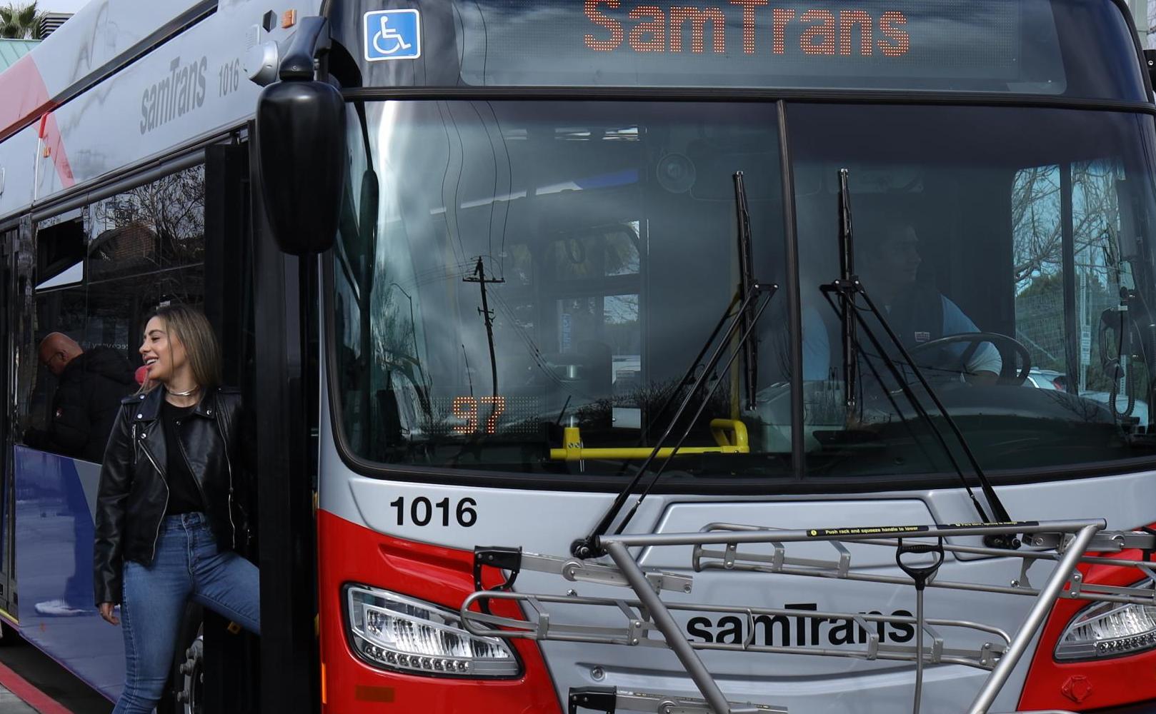 Group of people boarding SamTrans bus