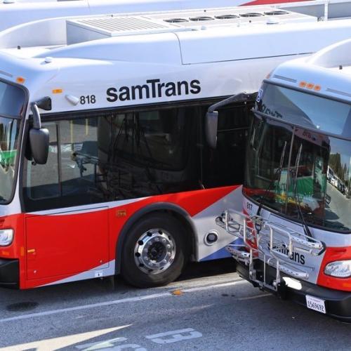 Two SamTrans buses parked side by side