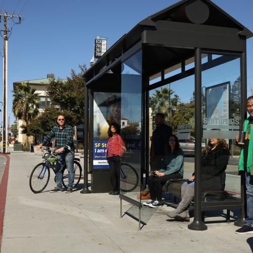 People waiting at a bus stop