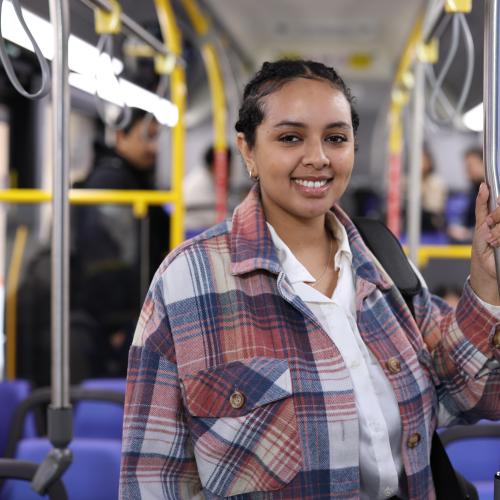 Passenger riding near the front of the bus